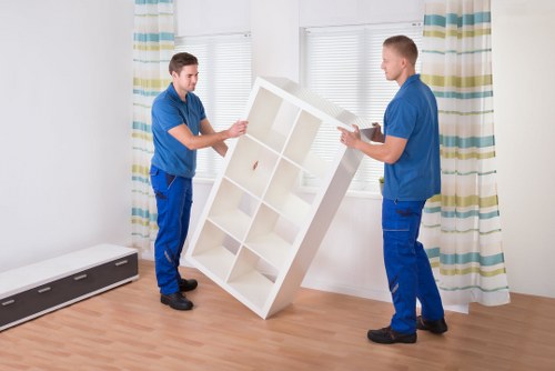 Professional movers handling furniture in Soho